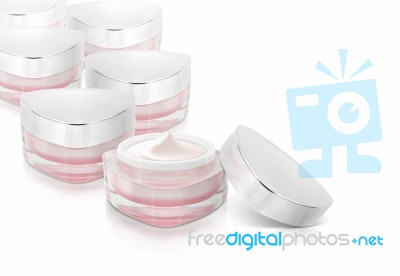 Many Pink Triangle Cosmetic Jar On White Background Stock Photo