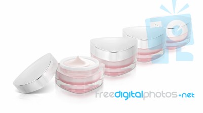 Many Pink Triangle Cosmetic Jar On White Background Stock Photo