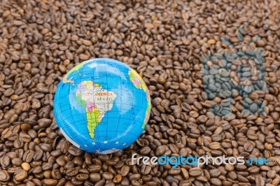 Many Whole Coffee Beans With South America On Globe Stock Photo