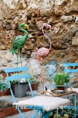 Marbella, Andalucia/spain - July 6 : Green And Pink Flamingos In… Stock Photo