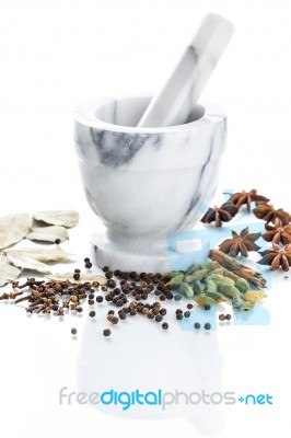 Marble Mortar And Pestle With Assorted Spices On White Backgroun… Stock Photo