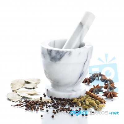 Marble Mortar And Pestle With Assorted Spices On White Backgroun… Stock Photo