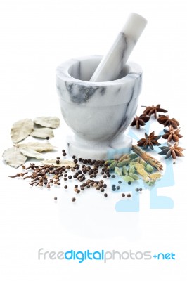 Marble Mortar And Pestle With Assorted Spices On White Backgroun… Stock Photo