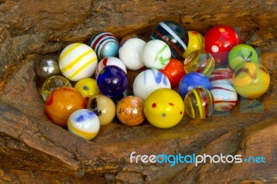 Marbles On Wood Stock Photo