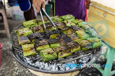 Marinate Fish In Banana Leaf On The Grill Stock Photo