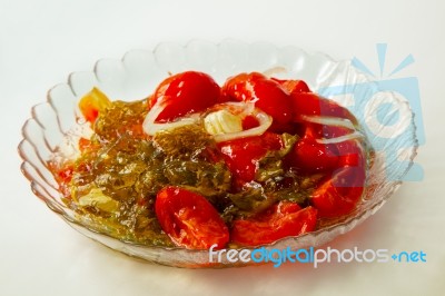 Marinated Tomatoes On A Plate Of Home Cooking Stock Photo