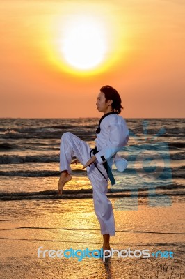 Martial Art Training At Sunset Stock Photo