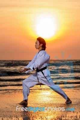 Martial Arts Training On Beach Stock Photo