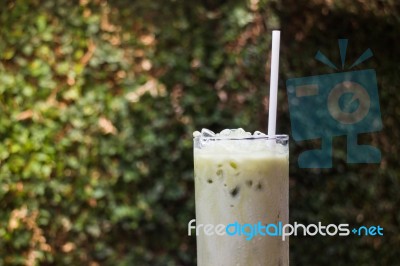 Matcha Tea With Milk On Garden Table Stock Photo