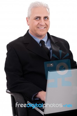 Mature Business Man Working In Notebook Stock Photo