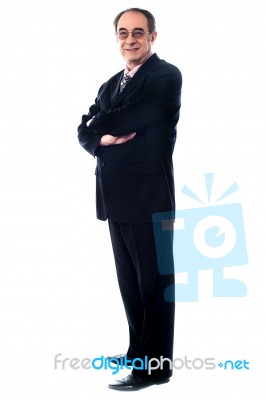 mature businessman with arm crossed Stock Photo