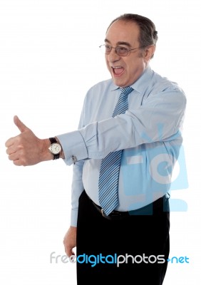 Mature Businessman With Thumbs Up Stock Photo