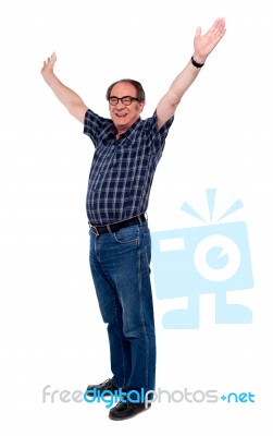 Mature Man Standing With Open Arms Stock Photo