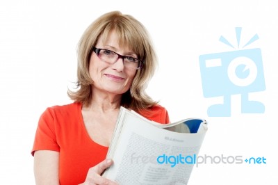 Mature Woman Reading Book Stock Photo