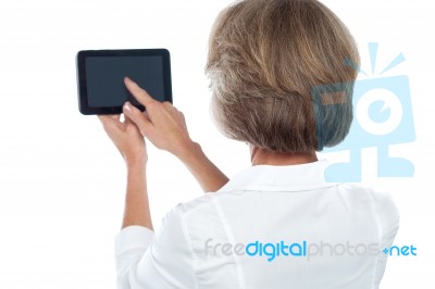 Mature Woman Using Tablet, From Back Stock Photo