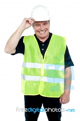 Matured Construction Worker Holding His Safety Helmet Stock Photo