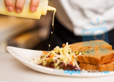 Mayonnaise Sauce Poured On A Vegetable Salad Stock Photo