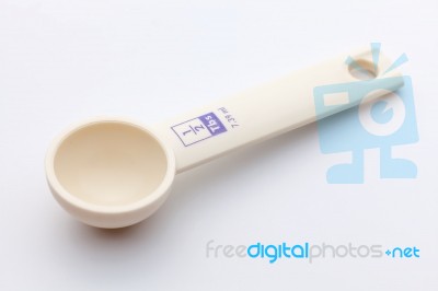 Measuring Spoon On White Background Stock Photo