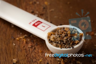 Measuring Spoon On Wooden Background Stock Photo