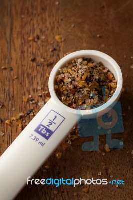 Measuring Spoon On Wooden Background Stock Photo