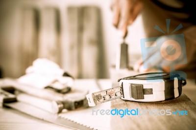 Measuring Tape On A Wood Plank. Build Concept Stock Photo