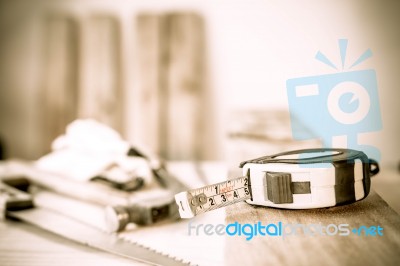 Measuring Tape On A Wood Plank. Build Concept Stock Photo