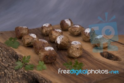 Meatballs On Wooden Cutting Board Stock Photo