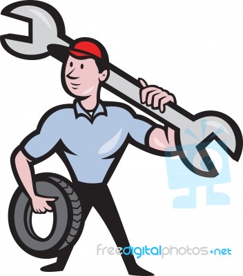 Mechanic With Tire Socket Wrench And Tire Stock Image