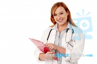 Medical Expert Holding Clipboard Stock Photo