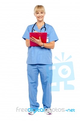 Medical Practitioner Posing With A Clipboard Stock Photo