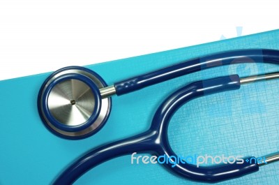 Medical Stethoscope On Blue Folder Stock Photo