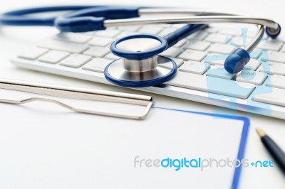 Medical Stethoscope On Computer Keyboard Stock Photo