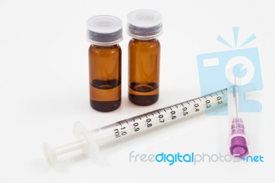 Medicine Vials And Syringe Isolated On White Background Stock Photo