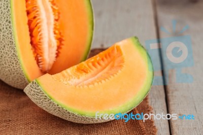 Melon Sliced ​​on Wooden Stock Photo