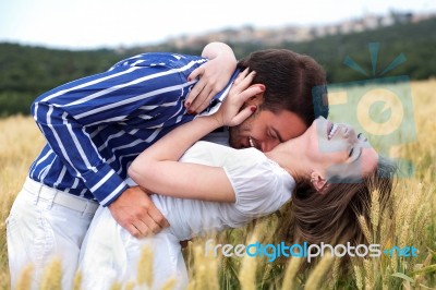 Men And Woman Hugging Stock Photo