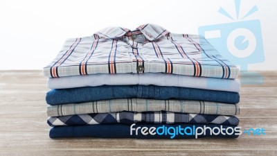 Men Shirts On Table Stock Photo