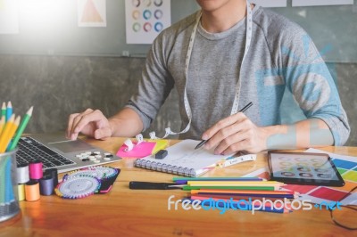 Men Working As Fashion Designer Drawing Sketches For Clothes In Stock Photo