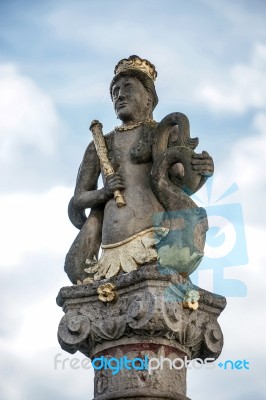 Mermaid Statue On Top Of A Column In Rothenburg Stock Photo