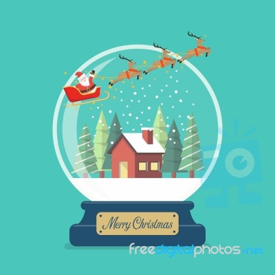 Merry Christmas Glass Ball With Santa Sleigh And Winter House Stock Image