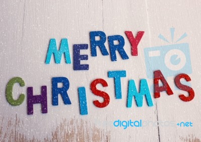 Merry Christmas Word On Wooden Background With Snow Stock Photo