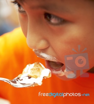 Messy Kid Eating Cream Cake Dessert Stock Photo