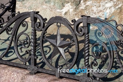 Metal Artwork Around The Statue Of Mario Cermenati In Lecco Stock Photo