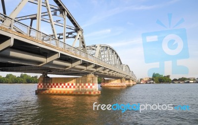 Metal Bridge Across Local River To Country Stock Photo