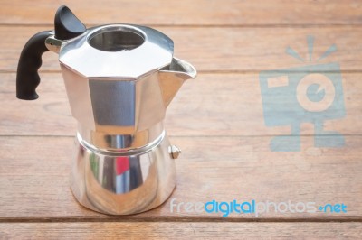 Metal Coffee Maker On Wooden Table Stock Photo