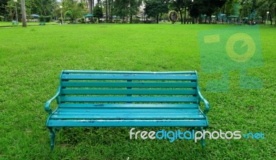 Metal Garden Chair On Green Grass Stock Photo