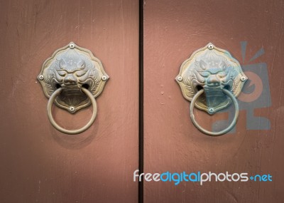 Metal Handle On Wooden Door Stock Photo