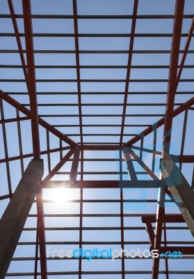 Metal Structure Of House Roof In Home Construction Site And Sun Stock Photo