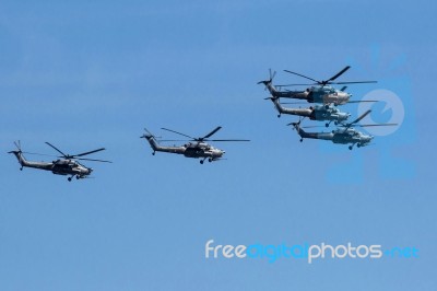 Mi-28n (havoc) Attack Helicopters Of Aerobatic Team Berkuty Fly Stock Photo