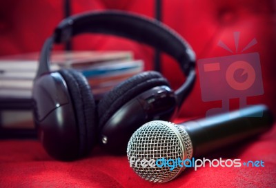 Microphone And Head Phone On Red Sofa Leather Use For Entertainm… Stock Photo