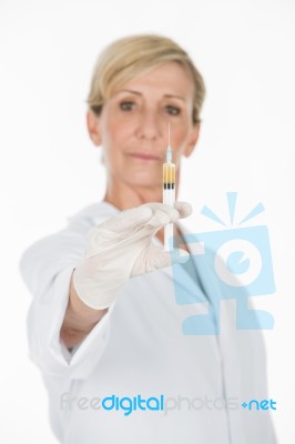 Middle Age Woman Doctor With Syringe Stock Photo